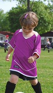 little girl with soccer ball