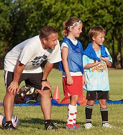 Volunteer coach with players